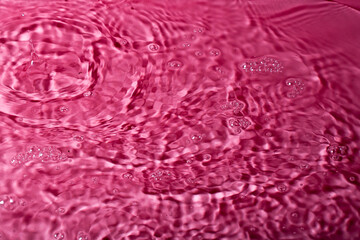 splash of water on a red background. Abstract wallpaper