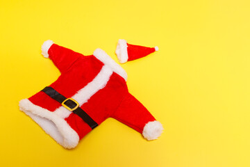 Santa suit with hat, on a yellow background