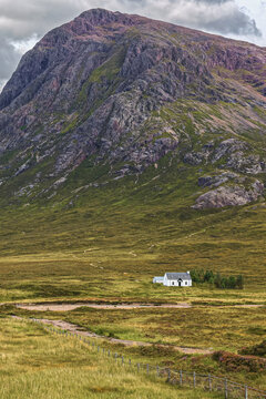 Stob Dearg, Buachaille Etive M&ograve;r at the entrance to Glencoe valley in the Highlands of Scotland where a narrow path across the moors leads to a remote cottage.
