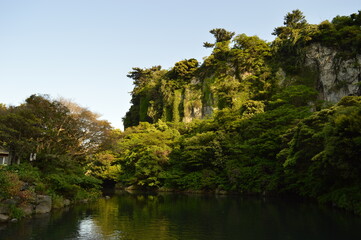 Fototapeta na wymiar Exploring the beautiful waterfalls and nature of Jeju Island in South Korea