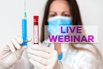 Conceptual hand writing showing Live Webinar. Concept meaning Interactive seminar transmitted over the web Real Time Laboratory blood test sample for medical diagnostic analysis
