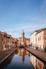 Fototapeta na wymiar Comacchio, Ferrara / Italy - August 2020: Civic tower of Comacchio