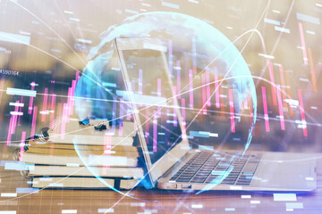 Forex market chart hologram and personal computer background. Multi exposure. Concept of investment.
