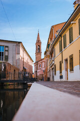 Comacchio, Ferrara / Italy - August 2020: View of the historic center of Comacchio at dawn, sky with clouds