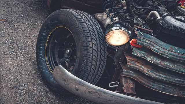 Old Ratrod Truck Detail. Wheel, Lights And Grill Are Visible.