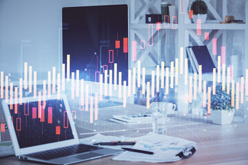 Stock market graph on background with desk and personal computer. Multi exposure. Concept of...