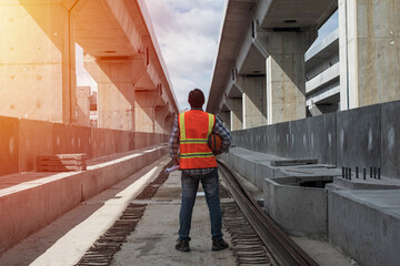 person walking on the railway