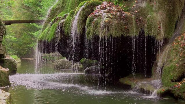 The unique beautiful Bigar waterfall full of green moss,  Caras-Severin, Romania.
