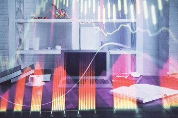 Stock market chart hologram drawn on personal computer background. Double exposure. Concept of...