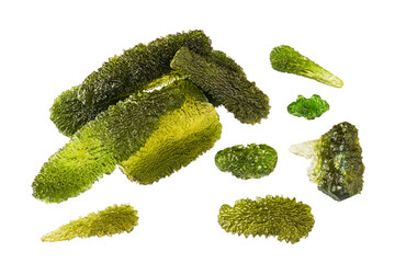 Group of rare green moldavite semi-precious stones isolated on white background. Various shaped raw...