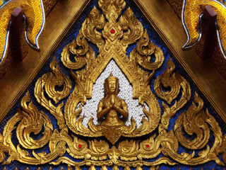 Bangkok, Thailand, January 25, 2013: Detail of the gold, silver and blue decoration on a building of the Royal Palace in Bangkok