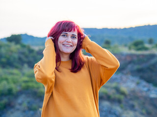 Closeup shot of a beautiful young lady with red hair in Cerro del Hierro, Sevilla, Spain