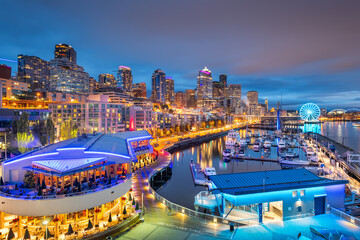 Seattle, Washington, USA pier and skyline at dusk.
