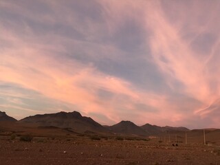 Fototapeta na wymiar Pink sky,Evening Dusk cloud on Sunset,idyllic nature cloud,dramatic sunlight with majestic peaceful sky in summer season in tafraout, Morocco. 