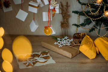 Christmas Advent Calendar hanging on the wall.Lights and bokeh on a christmas tree