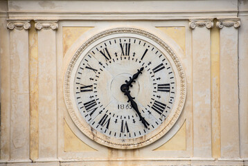 Fototapeta na wymiar Antique wall clock with roman numerals