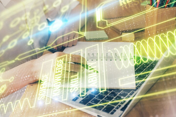 Education theme hologram over woman's hands writing background. Concept of study. Double exposure