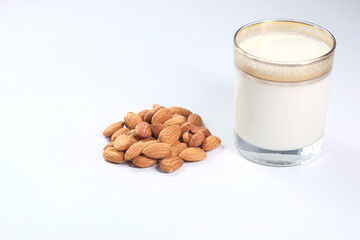  almond nut and milk white background with copy space 