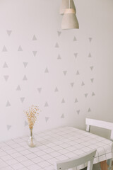 Mock up wall in modern kitchen interior. Kitchen table and chair. Cozy home. Minimal, Scandinavian style. Real photo 