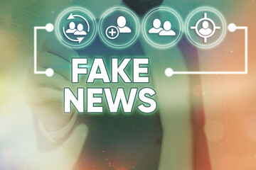 Word writing text Fake News. Business photo showcasing false information publish under the guise of...