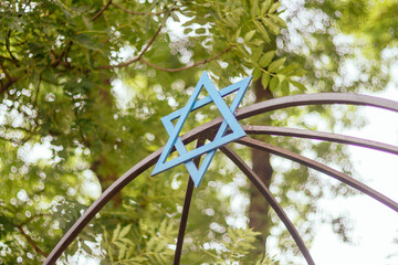Hexagonal jewish star on a metal structure close up
