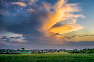 storm clouds at sunset over the city