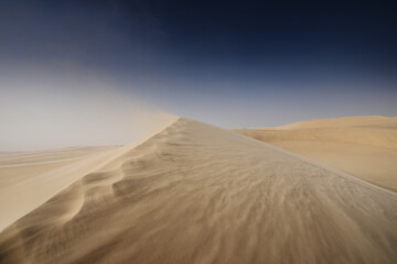 Fototapeta na wymiar Windy at Siwa's desert. Siwa is an oasis located at western of Egypt.