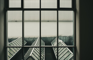 Contemporary architecture, view from the window on the roof, rainy day, vintage look