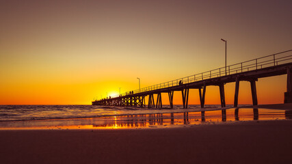Fototapeta na wymiar Port Noarlunga beach with jetty at sunset, South Australia