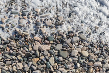 Fototapeta na wymiar Rocks and stones on the beach pattern