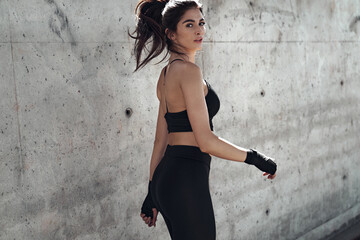Attractive brunette woman doing the urban boxing workout