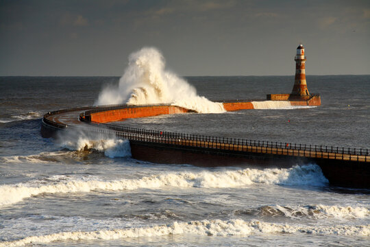 Huge Waves crashing against Roker Pier, Sunderland, Tyne and Wear, England, United Kingdom.