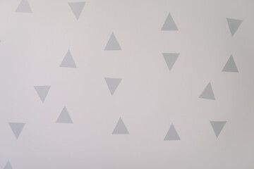 triangle wall stickers. white walls with decorations in a scandinavian style. interior details. copy space