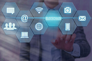 Writing note showing Blockchain. Business concept for digital database containing information that can be used Grids and different icons latest digital technology concept