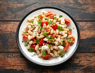 White Bean Salad with Cherry Tomatoes, Feta cheese and parsley. Healthy vegetarian, vegan food
