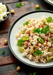 Chickpeas salad with feta cheese, avocado and herbs. healthy food