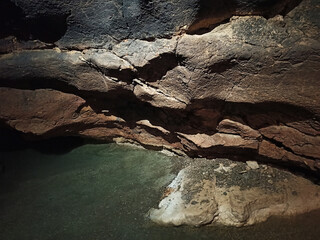 Journey. View inside a deep cave to the south. stalactites and stalagmites.