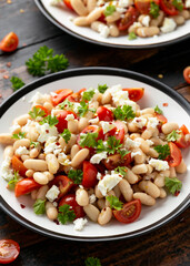 White Bean Salad with Cherry Tomatoes, Feta cheese and parsley. Healthy vegetarian, vegan food