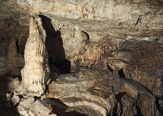 Journey. View inside a deep cave to the south. stalactites and stalagmites.