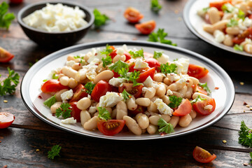 White Bean Salad with Cherry Tomatoes, Feta cheese and parsley. Healthy vegetarian, vegan food