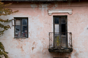 Old balcony in the old weathered house. 