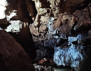 Journey. View inside a deep cave to the south. stalactites and stalagmites.