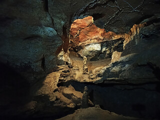 Journey. View inside a deep cave to the south. stalactites and stalagmites.