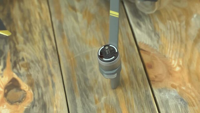 Macro shot brushless motor. Preparing a drone before flight, installing propellers.