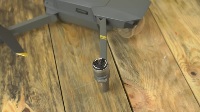 Macro shot brushless motor. Preparing a drone before flight, installing propellers.