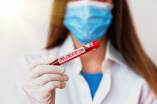 Text sign showing Implementation. Business photo text application of making something active or effective Laboratory blood test sample shown for medical diagnostic analysis result