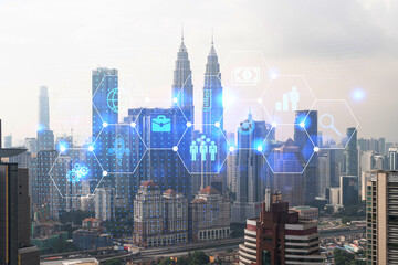 Fototapeta na wymiar Research and development hologram over panorama city view of Kuala Lumpur. KL is hub of new technologies to optimize business in Malaysia, Asia. Concept of exceeding opportunities. Double exposure.