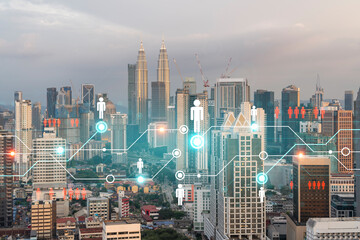 Hologram of social media icons over sunset panoramic cityscape of Kuala Lumpur, Malaysia, Asia. The concept of people connections in KL. Multi exposure.