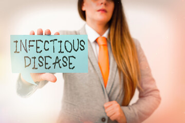 Conceptual hand writing showing Infectious Disease. Concept meaning caused by pathogenic...