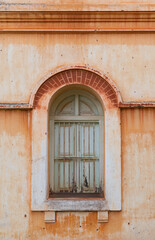 Fototapeta na wymiar green window on old retro building.